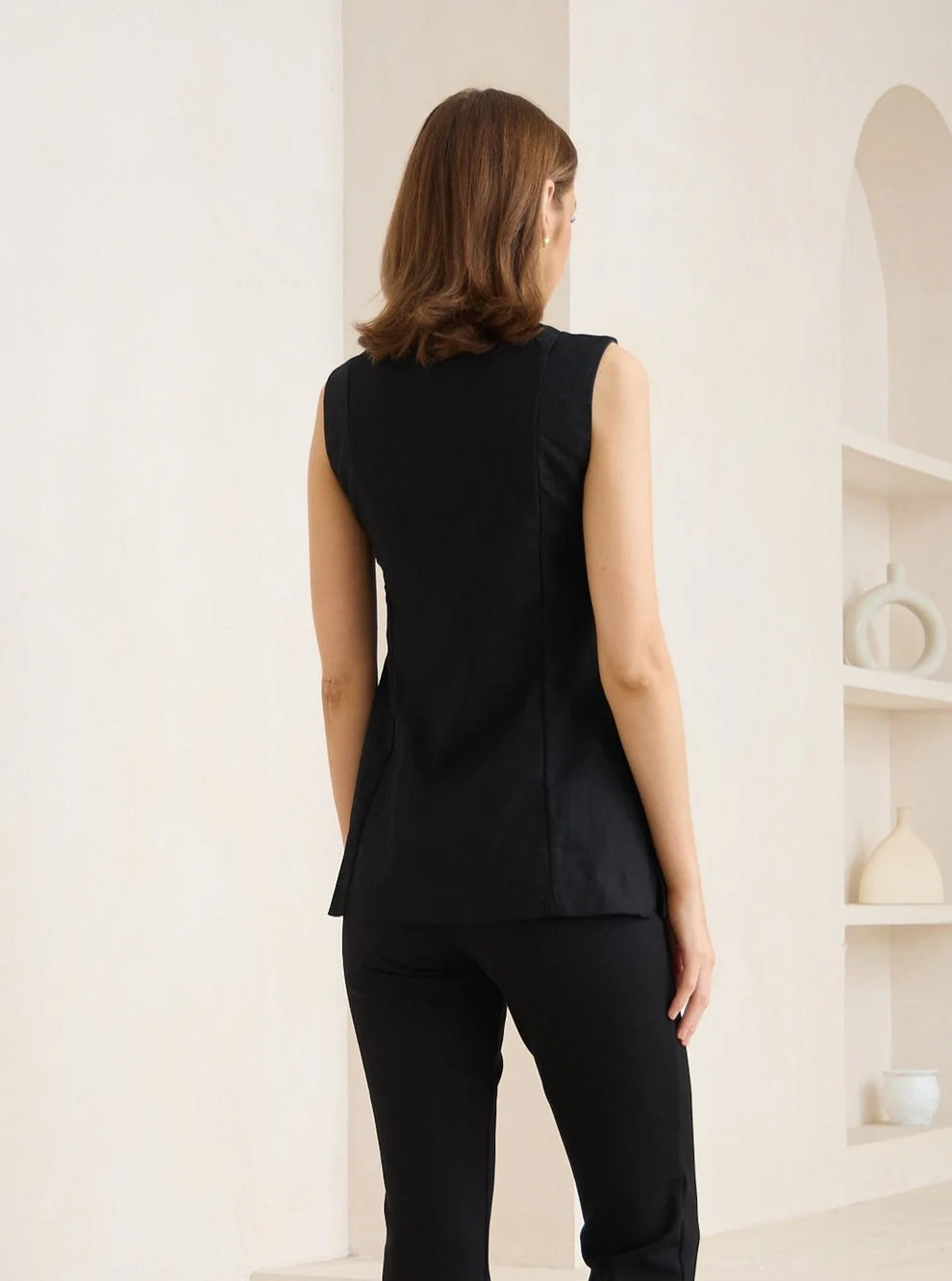 Black vest with pockets designed for layering