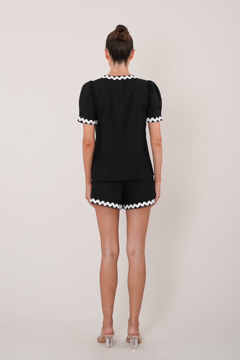 black top with white trim cropped with ties back view