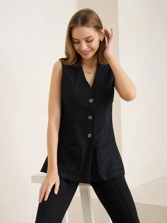 Black vest with pockets designed for layering 
