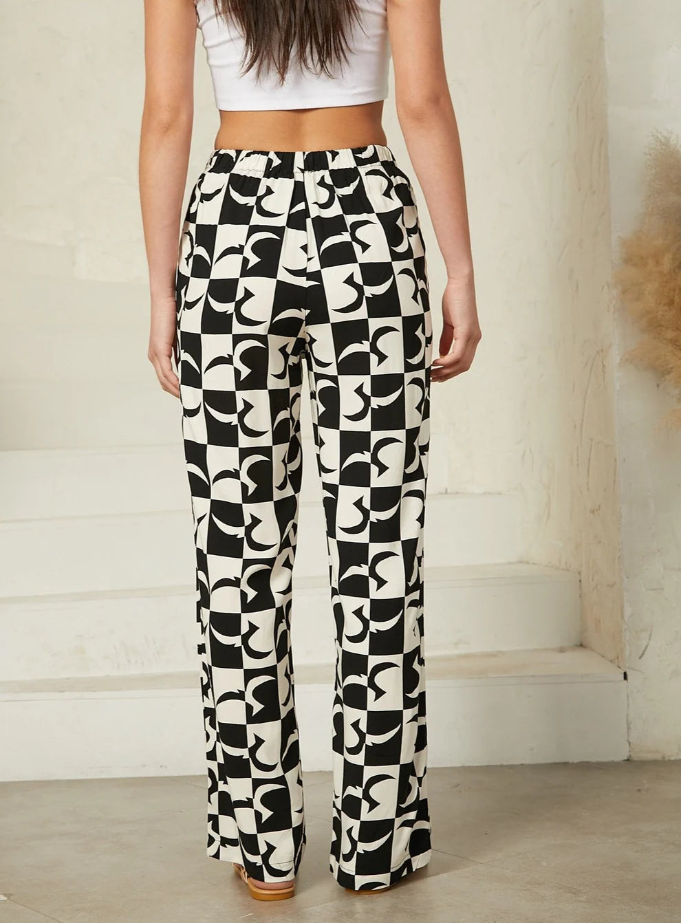 Geo print pants featuring a bold geometric design for a contemporary look. Relaxed design, drawstring. Flattering Fit. 