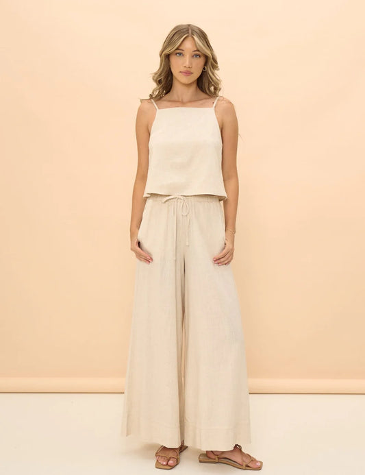 Linen Beige Wide Leg pant with tie waist and relaxed fit. 