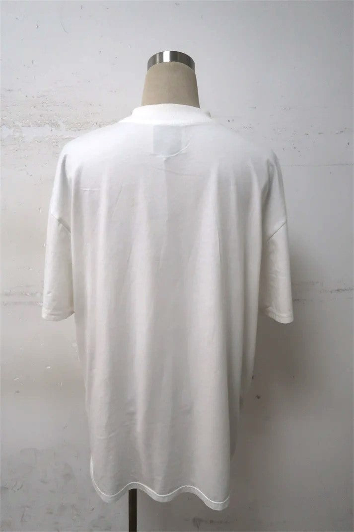 back view of a soft cotton t-shirt in a white color, featuring a martini graphic design on the chest. The t-shirt has a crew neckline and short sleeves, perfect for casual wear oversized