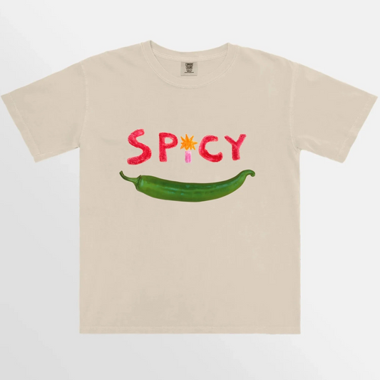 Front view of a soft cotton t-shirt in a light cream color, featuring a spicy  graphic design on the chest. The t-shirt has a crew neckline and short sleeves, perfect for casual wear or layering