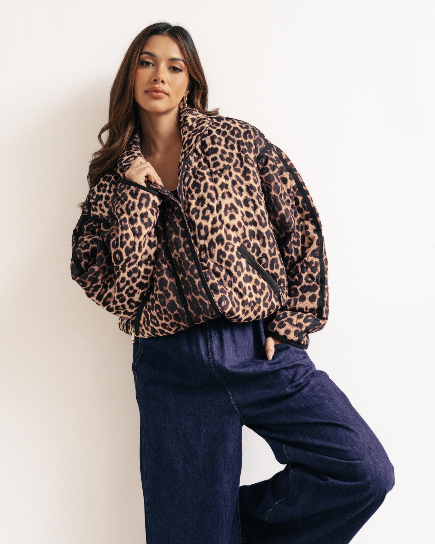 Trendy Leopard Print Puffer Jacket with black detailing. 